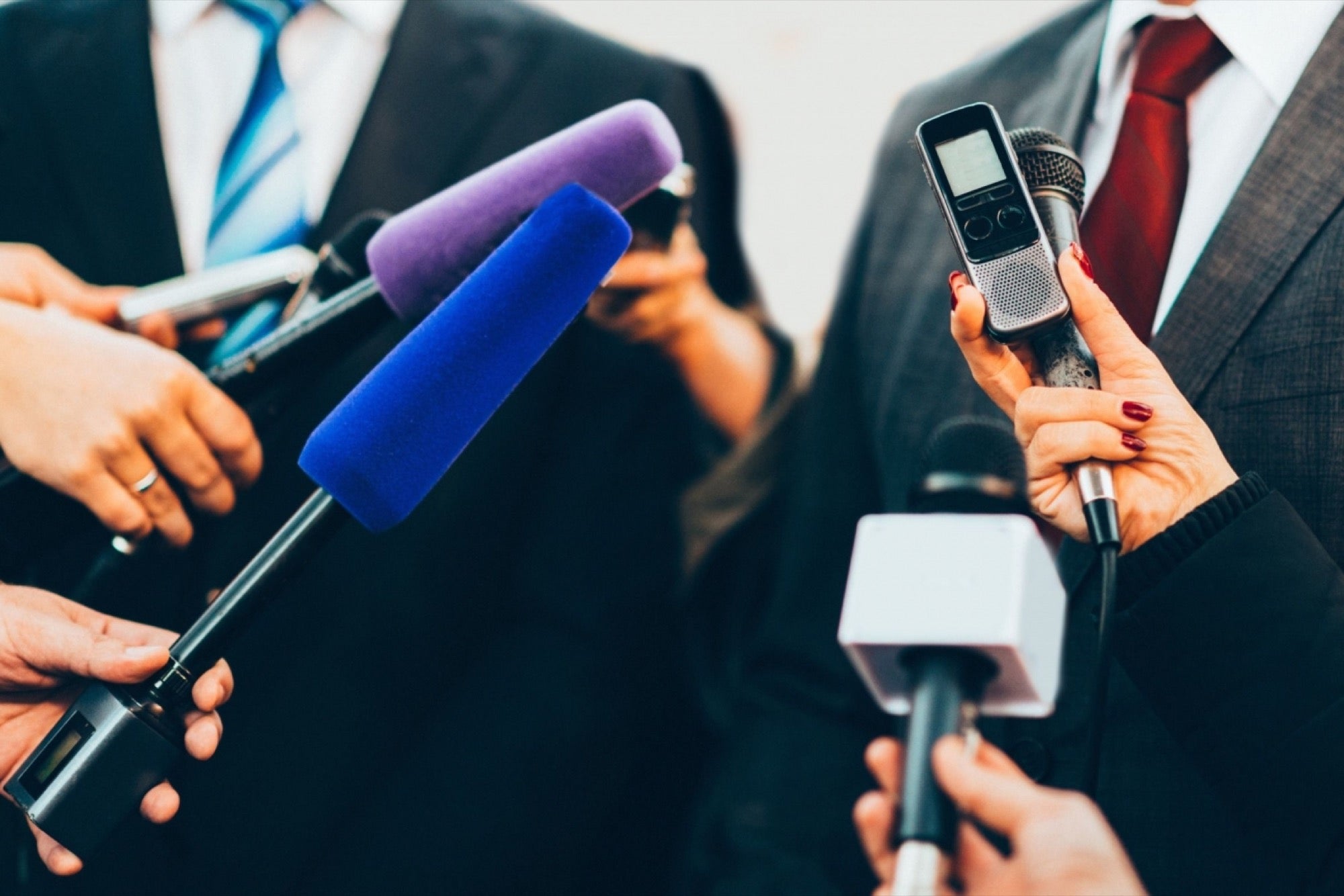 Image of AIME360 press conference, press interviewing entrepreneur