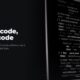 Lines of code on a dark screen, in black and white, beside the headline Faster code, same code