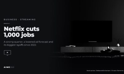 A dark living room with a blank television, in black and white, beside the headline Netflix cuts 1,000 jobs