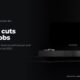A dark living room with a blank television, in black and white, beside the headline Netflix cuts 1,000 jobs