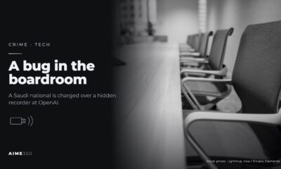 An empty boardroom table lined with office chairs, in black and white, beside the headline A bug in the boardroom