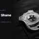A police badge on a dark uniform, in black and white, beside the headline Officer Shane Seiber