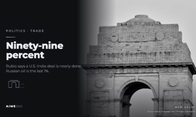 India Gate in New Delhi, in black and white, beside the headline Ninety-nine percent