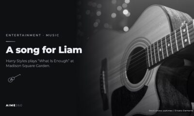 An acoustic guitar against string lights, in black and white, beside the headline A song for Liam